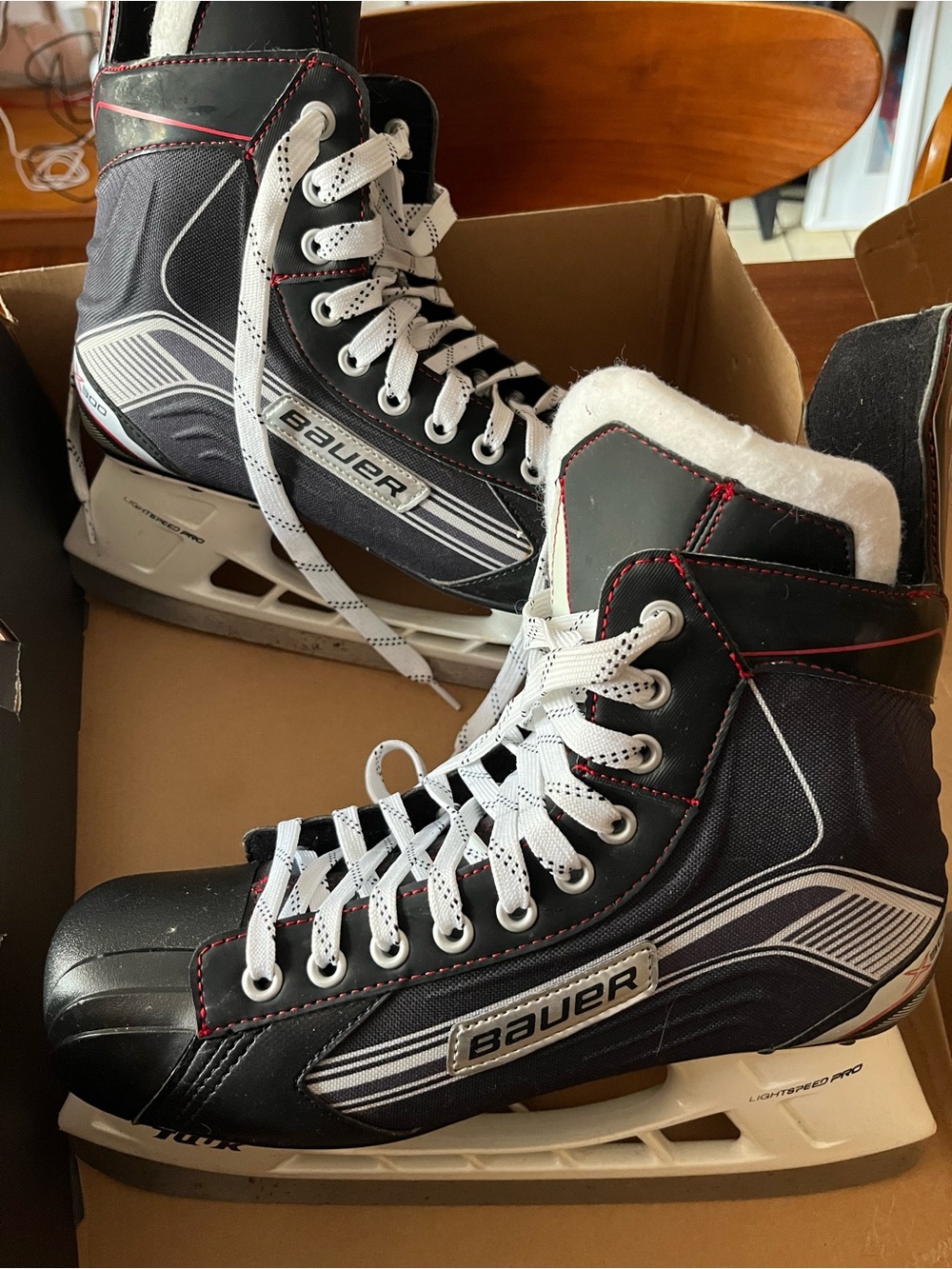 Bauer Black Hockey Skates with White Laces and Red Stitching